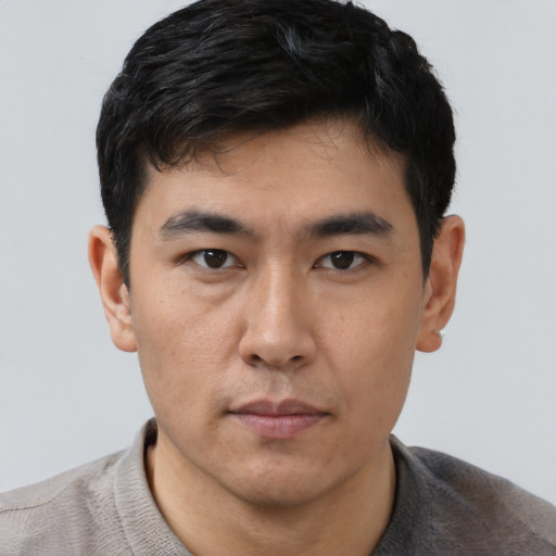 Neutral asian young-adult male with short  black hair and brown eyes