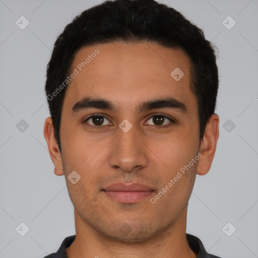 Joyful latino young-adult male with short  brown hair and brown eyes