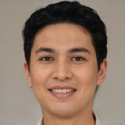 Joyful asian young-adult male with short  brown hair and brown eyes