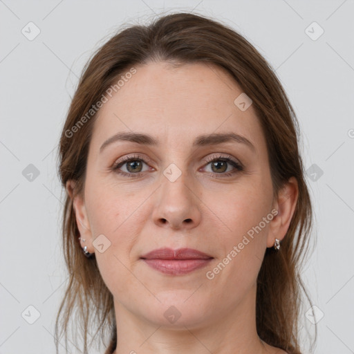 Joyful white young-adult female with medium  brown hair and grey eyes