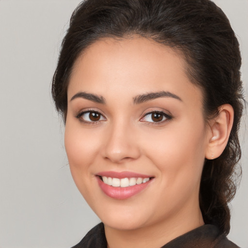 Joyful white young-adult female with medium  brown hair and brown eyes