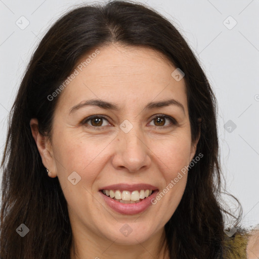 Joyful white adult female with long  brown hair and brown eyes