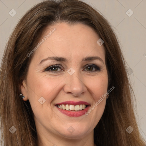 Joyful white adult female with long  brown hair and brown eyes