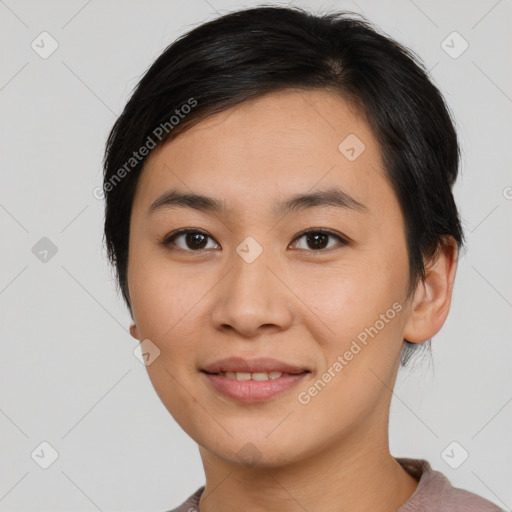 Joyful asian young-adult female with short  brown hair and brown eyes