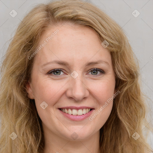 Joyful white young-adult female with long  brown hair and green eyes