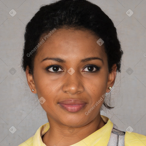 Joyful black young-adult female with short  black hair and brown eyes