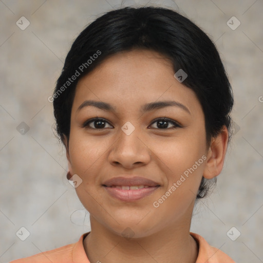 Joyful latino young-adult female with short  brown hair and brown eyes