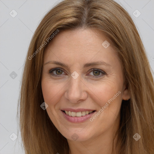 Joyful white adult female with long  brown hair and brown eyes