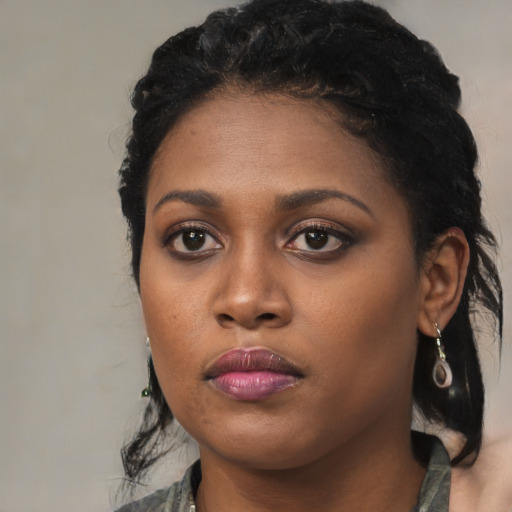 Neutral black young-adult female with medium  black hair and brown eyes
