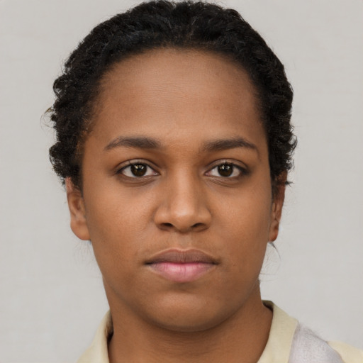 Neutral black young-adult female with short  brown hair and brown eyes