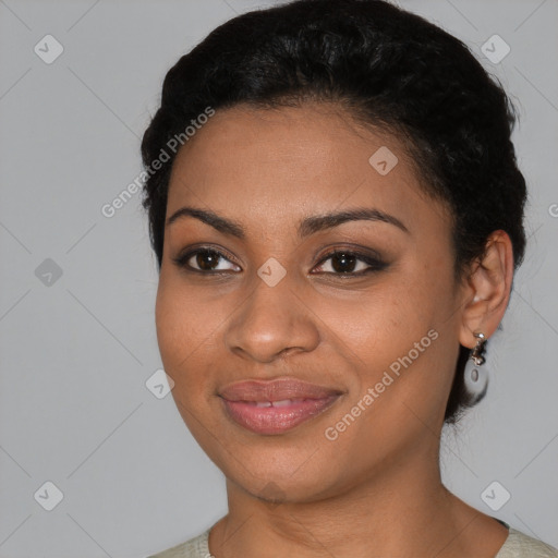 Joyful black young-adult female with short  black hair and brown eyes