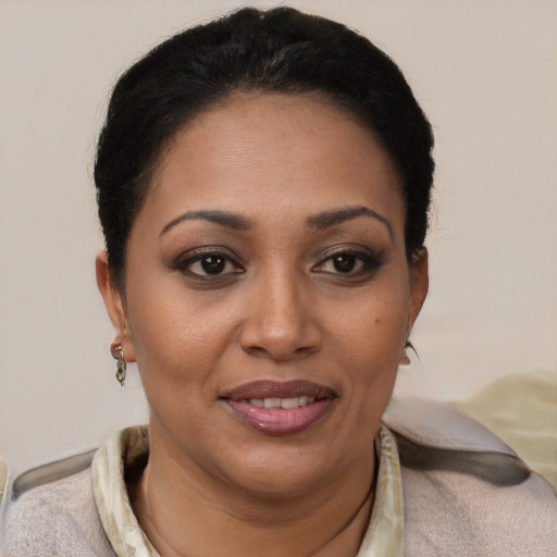 Joyful white adult female with short  brown hair and brown eyes
