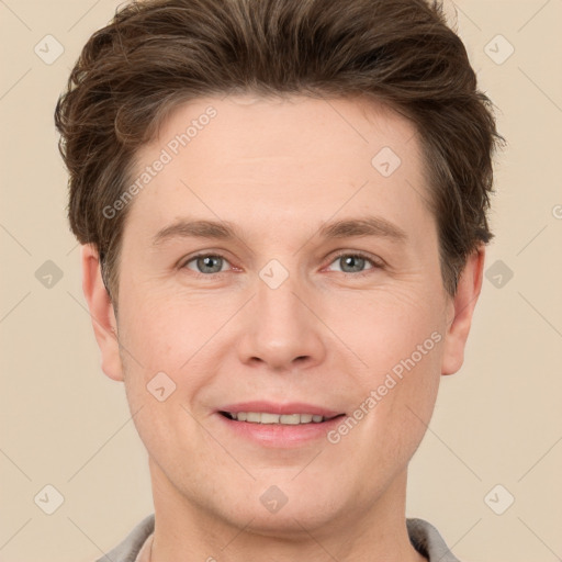 Joyful white adult male with short  brown hair and grey eyes