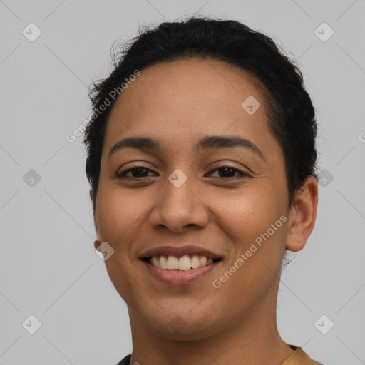 Joyful latino young-adult female with short  black hair and brown eyes