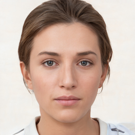 Neutral white young-adult female with short  brown hair and grey eyes