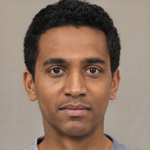 Neutral black young-adult male with short  black hair and brown eyes
