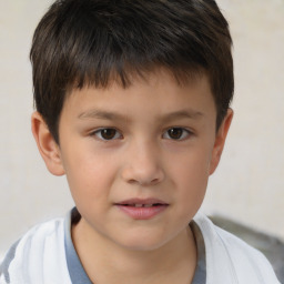 Joyful white child male with short  brown hair and brown eyes