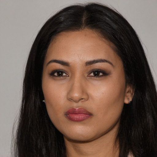Neutral latino young-adult female with long  black hair and brown eyes