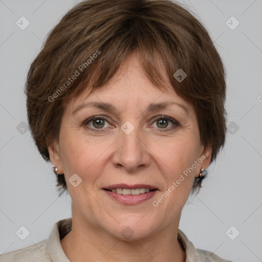 Joyful white adult female with medium  brown hair and grey eyes