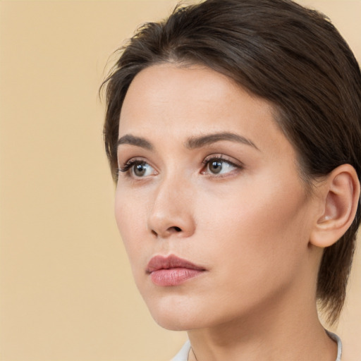 Neutral white young-adult female with medium  brown hair and brown eyes