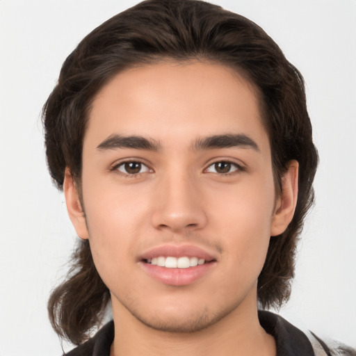 Joyful white young-adult male with medium  brown hair and brown eyes