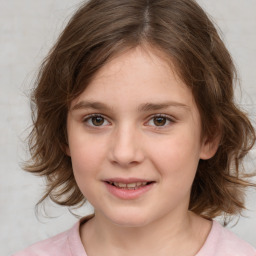 Joyful white child female with medium  brown hair and brown eyes