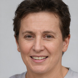 Joyful white adult female with short  brown hair and brown eyes