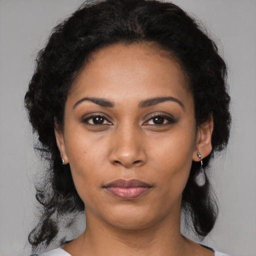 Neutral latino young-adult female with medium  black hair and brown eyes