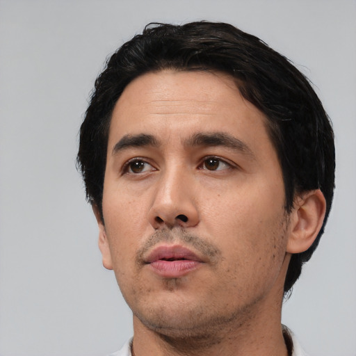 Neutral white adult male with short  black hair and brown eyes