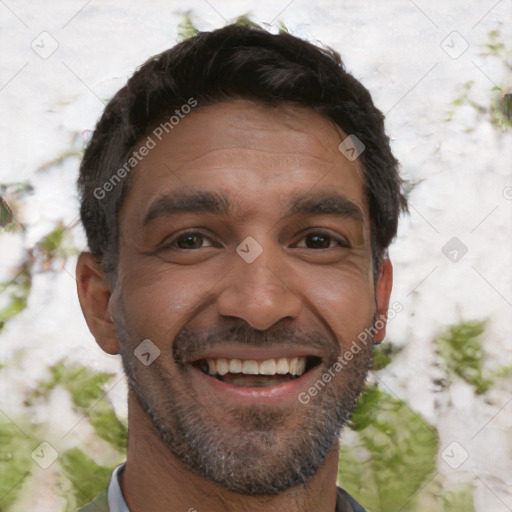 Joyful white adult male with short  black hair and brown eyes