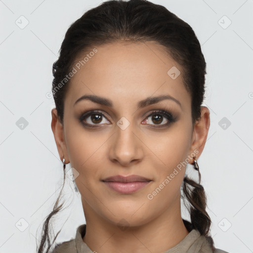 Joyful latino young-adult female with long  brown hair and brown eyes