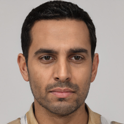 Neutral latino young-adult male with short  black hair and brown eyes