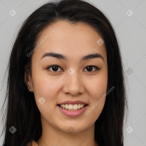 Joyful asian young-adult female with long  brown hair and brown eyes