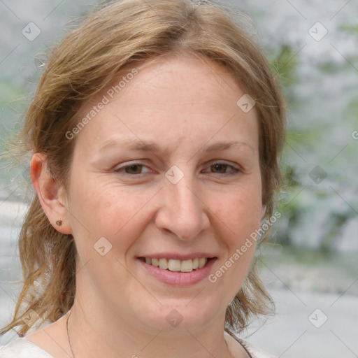 Joyful white adult female with medium  brown hair and grey eyes