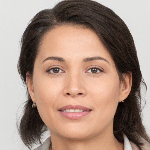 Joyful white young-adult female with medium  brown hair and brown eyes