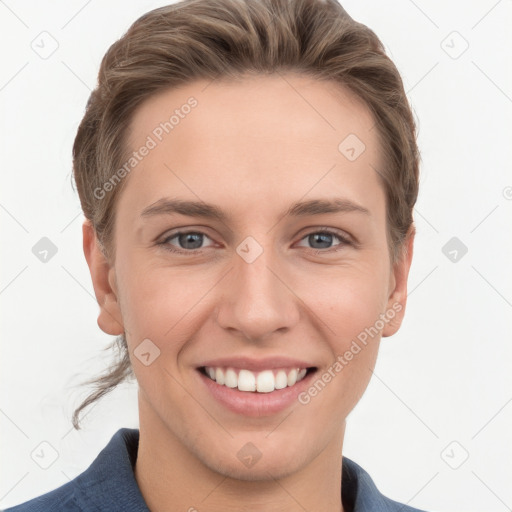 Joyful white young-adult female with short  brown hair and grey eyes