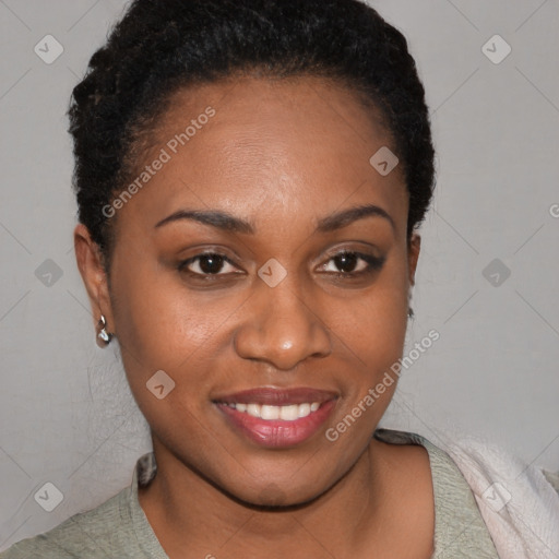 Joyful black young-adult female with short  brown hair and brown eyes