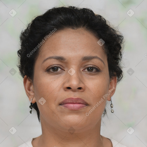 Joyful latino adult female with short  brown hair and brown eyes