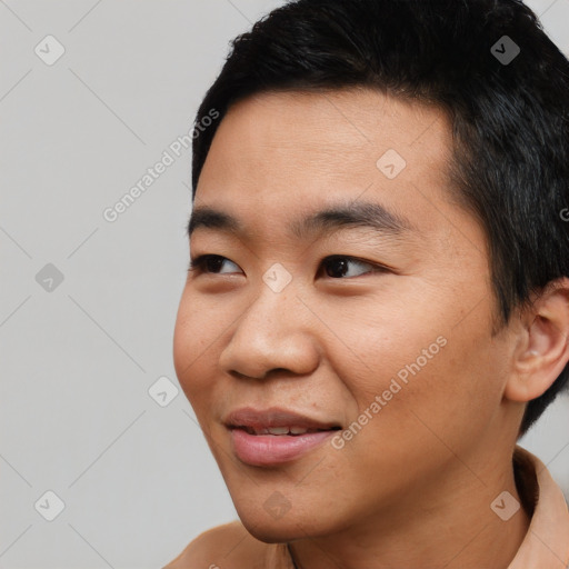 Joyful asian young-adult male with short  black hair and brown eyes