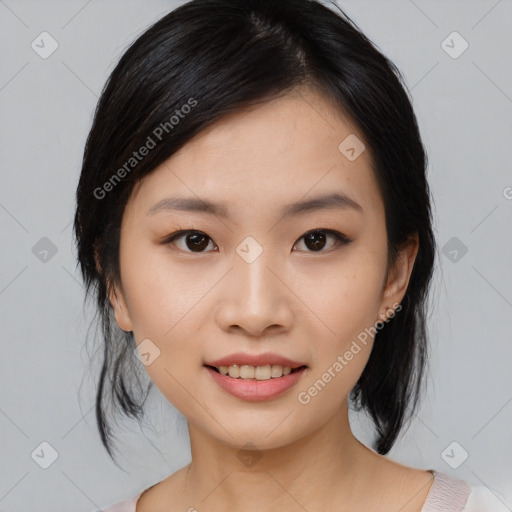 Joyful asian young-adult female with medium  black hair and brown eyes