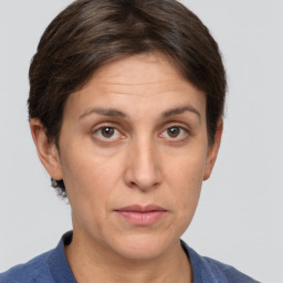 Joyful white adult female with short  brown hair and grey eyes