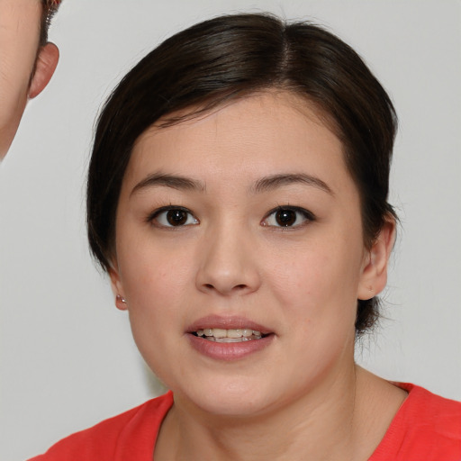 Joyful white young-adult female with short  brown hair and brown eyes