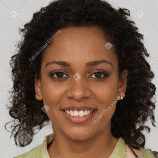 Joyful black young-adult female with medium  brown hair and brown eyes