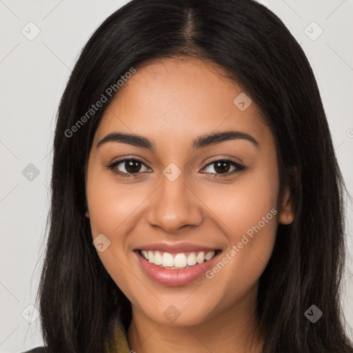 Joyful latino young-adult female with long  brown hair and brown eyes