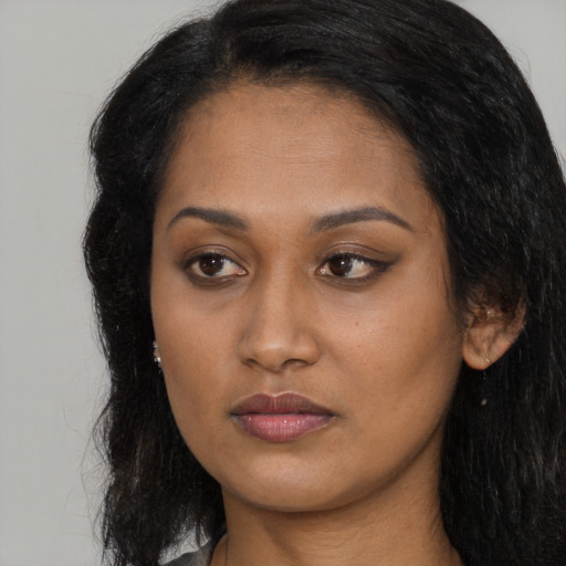 Neutral latino young-adult female with long  brown hair and brown eyes