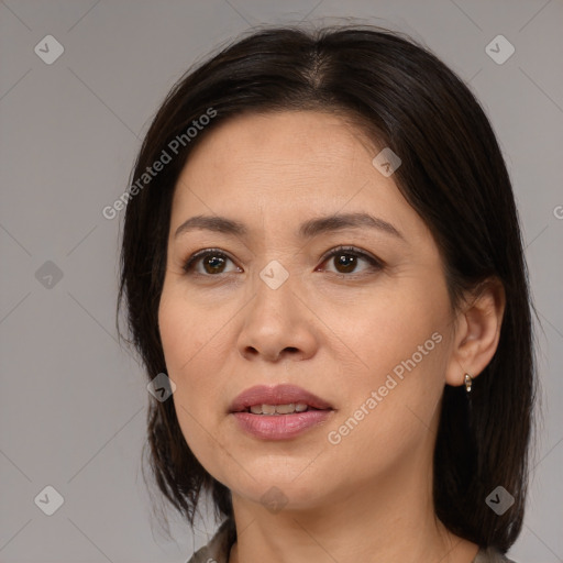 Joyful white adult female with medium  brown hair and brown eyes