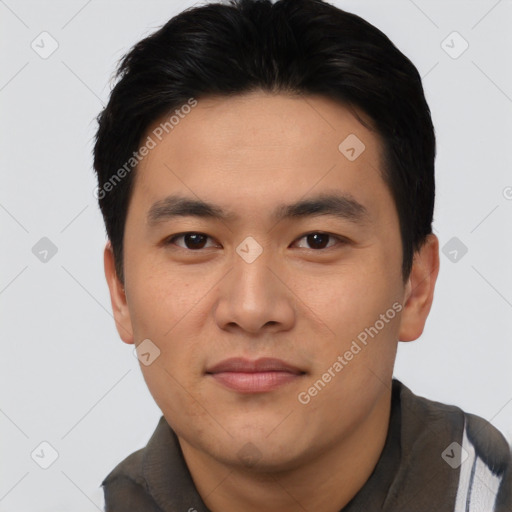 Joyful asian young-adult male with short  black hair and brown eyes