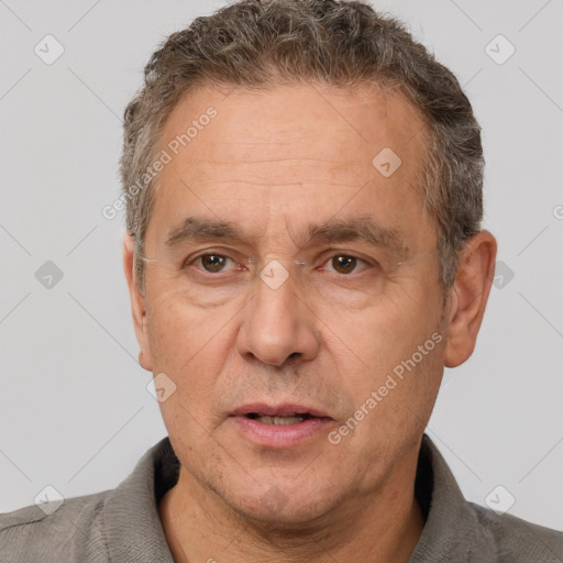 Joyful white middle-aged male with short  brown hair and brown eyes