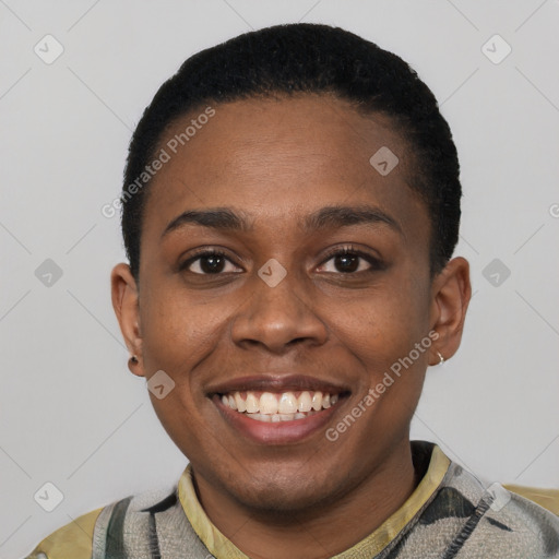 Joyful black young-adult female with short  black hair and brown eyes