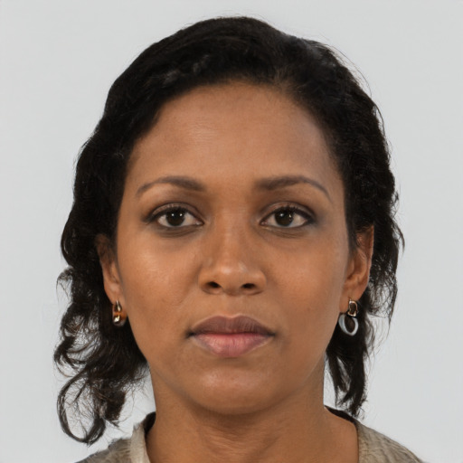 Neutral black adult female with medium  black hair and brown eyes